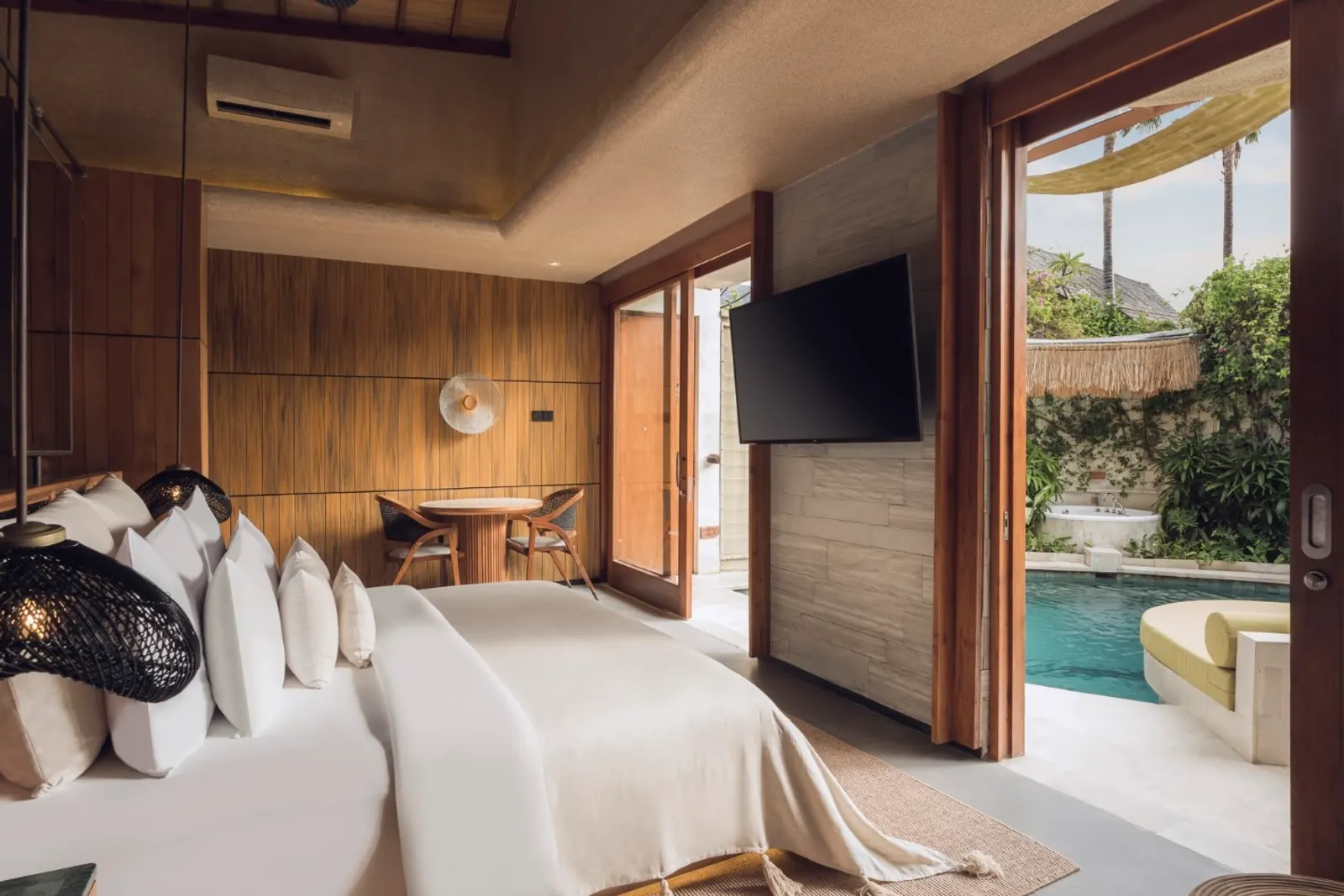 Bedroom opening onto the private pool and Jacuzzi at Sini Vie Resort Seminyak