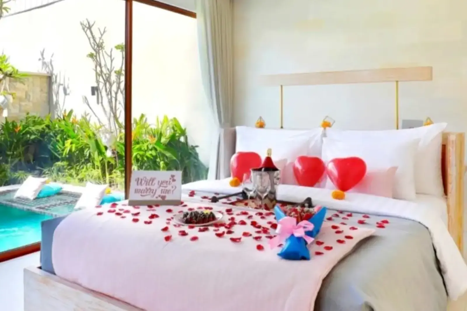 Romantic honeymoon bed decoration beside a private villa pool in Bali